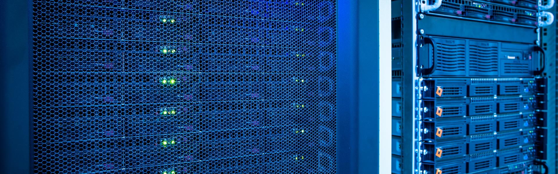 Interior of a data center server rack with blue lighting and active status LEDs.